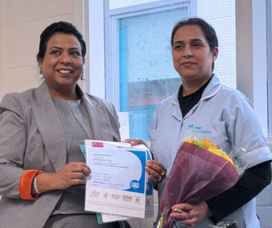 Gurdip Kaur Dass holding her NVQ Level 2 certificate at the Aegis Care Solutions training academy in Leeds.